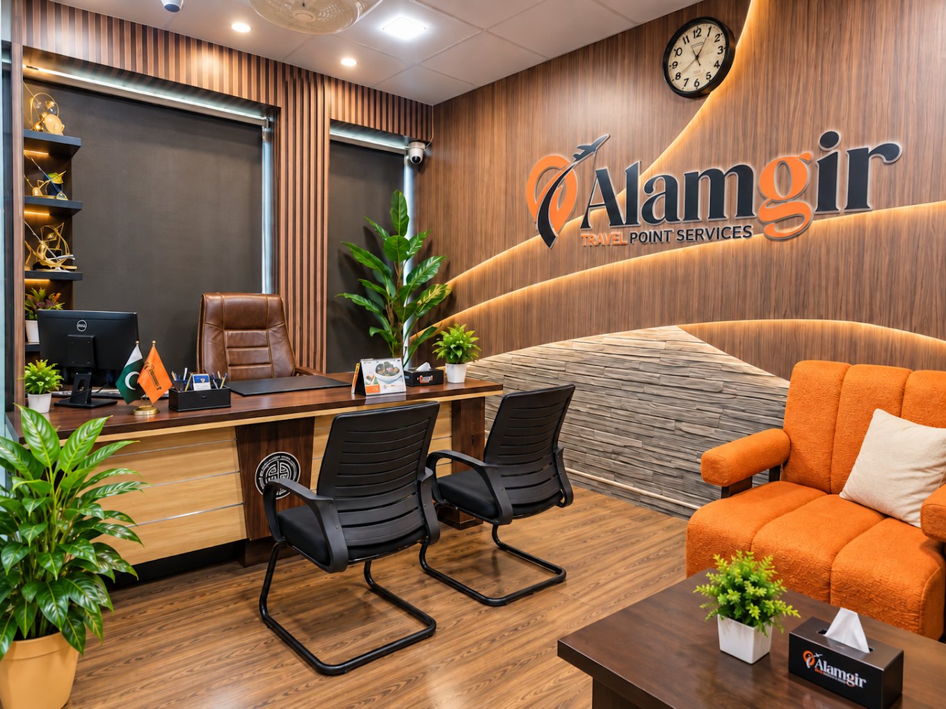 Office cabin with the Alamgir Travel Point Services logo wall and a seating area